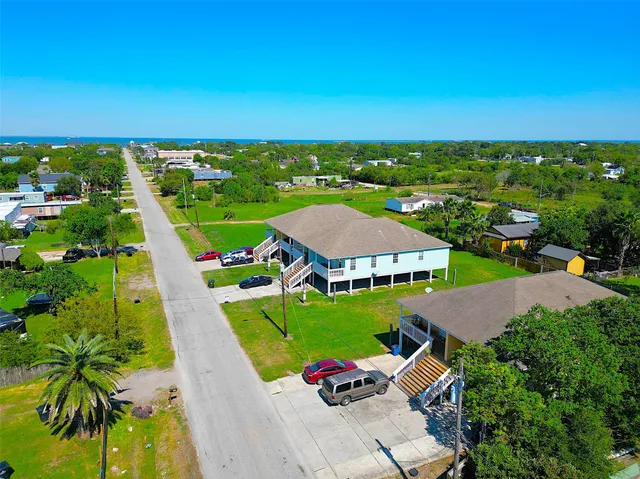 an aerial view of a house with a garden