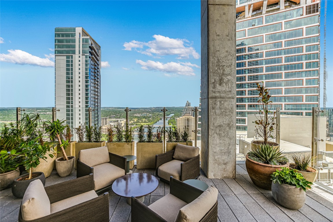 610 Davis Street, Unit 2409 Austin, TX 78701 - Photo 33 of 39 a balcony with outdoor seating and plants