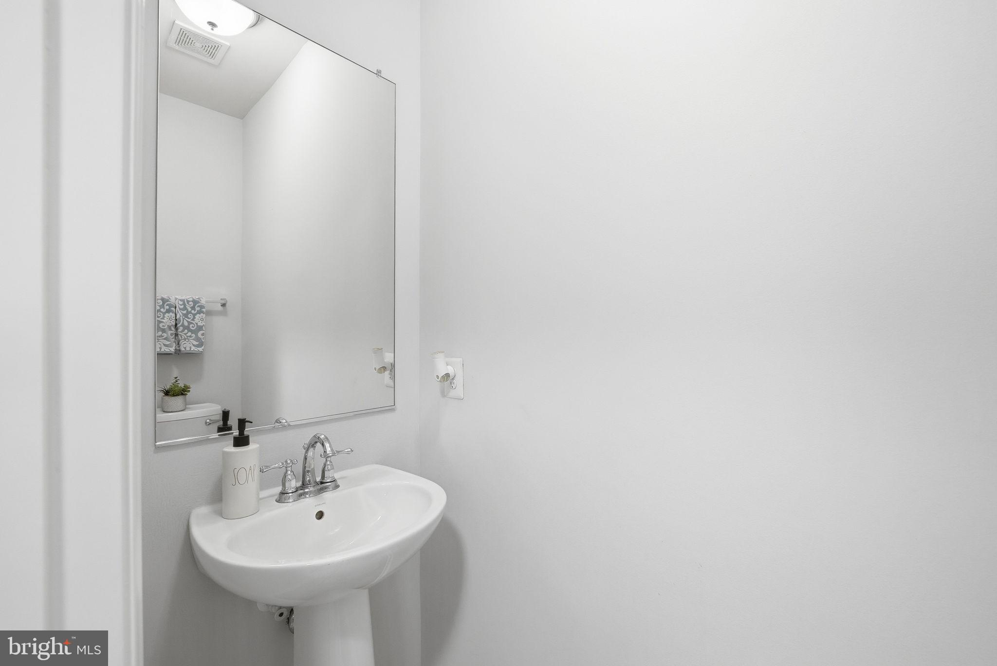 214 Shields Road Stafford, VA 22554 - Photo 16 of 47 Sleek and modern powder room design.