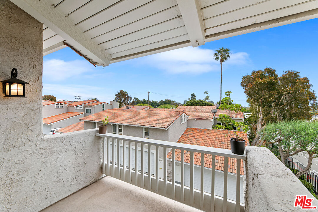 28398 Rey De Copas Lane Malibu, CA 90265 - Photo 17 of 44 a balcony with an outdoor seating