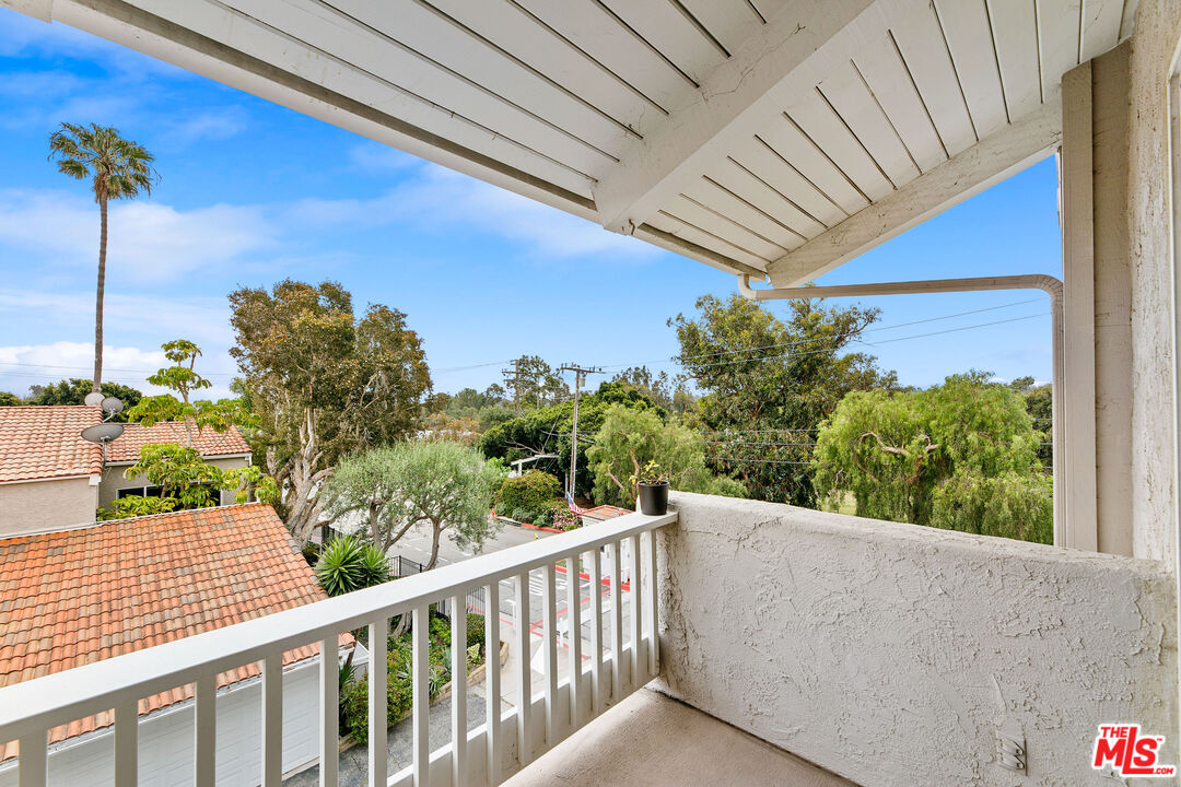 28398 Rey De Copas Lane Malibu, CA 90265 - Photo 18 of 44 a view of a balcony with a couple of flower plants
