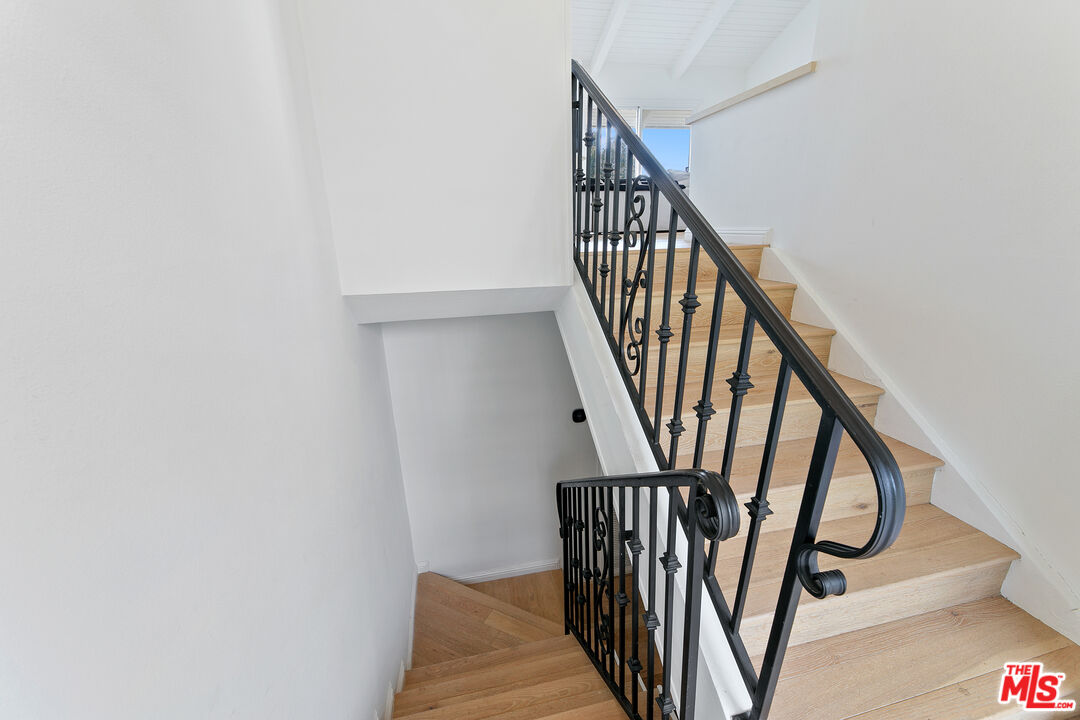 28398 Rey De Copas Lane Malibu, CA 90265 - Photo 21 of 44 a view of staircase with railing and white walls