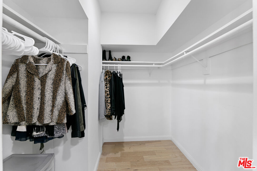 28398 Rey De Copas Lane Malibu, CA 90265 - Photo 32 of 44 a view of walk in closet with clothes and shoes