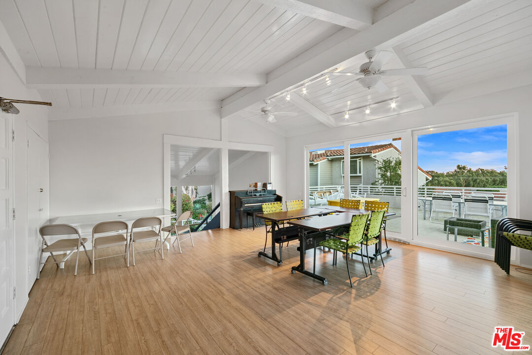 28398 Rey De Copas Lane Malibu, CA 90265 - Photo 44 of 44 a view of a dining room with furniture window and wooden floor