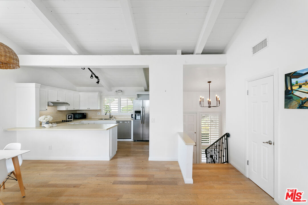 28398 Rey De Copas Lane Malibu, CA 90265 - Photo 5 of 44 a view of kitchen with sink and wooden floor