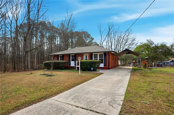 a front view of a house with a yard