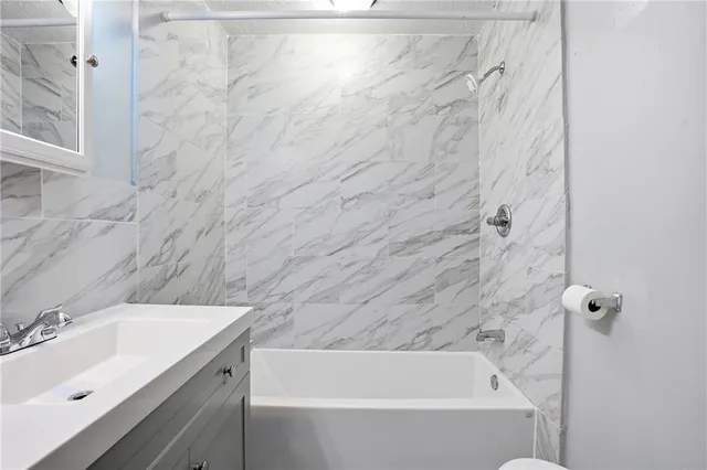 a bathroom with a sink and a bathtub