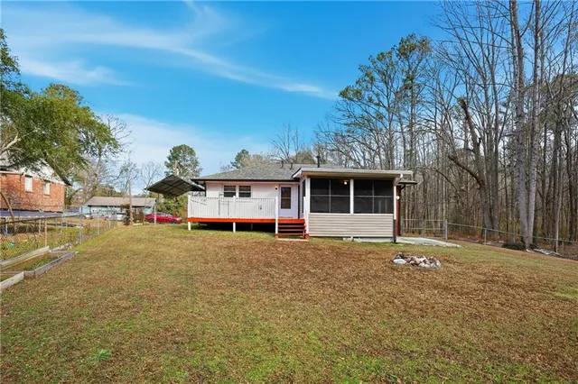 an aerial view of residential house with outdoor space