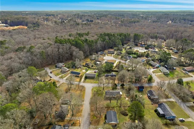 an aerial view of residential houses with outdoor space