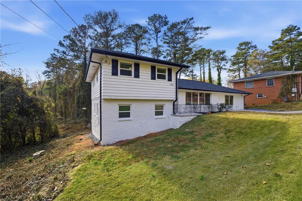 2967 Flat Shoals Road Decatur, GA 30034 - Photo 2 of 37 a front view of a house with a yard