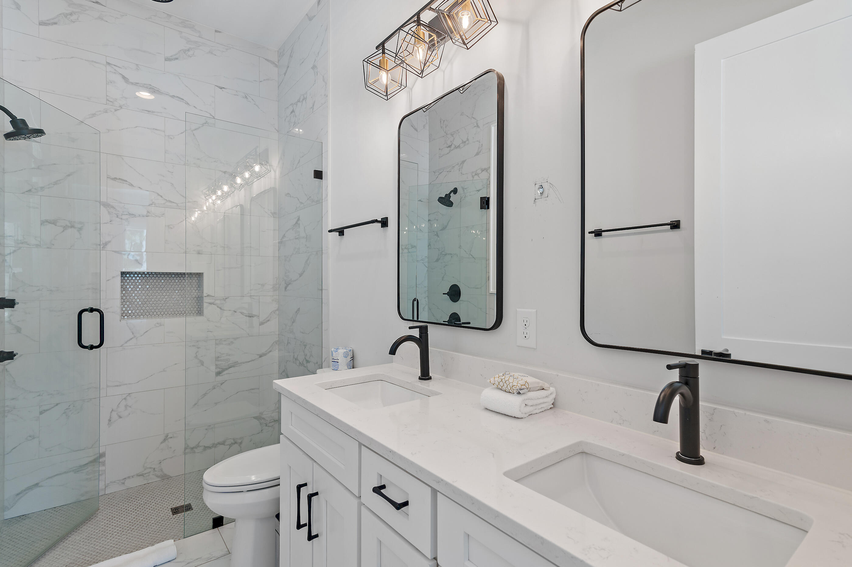 13 Jp Lane Santa Rosa Beach, FL 32459 - Photo 17 of 31 a bathroom with a sink a toilet and shower