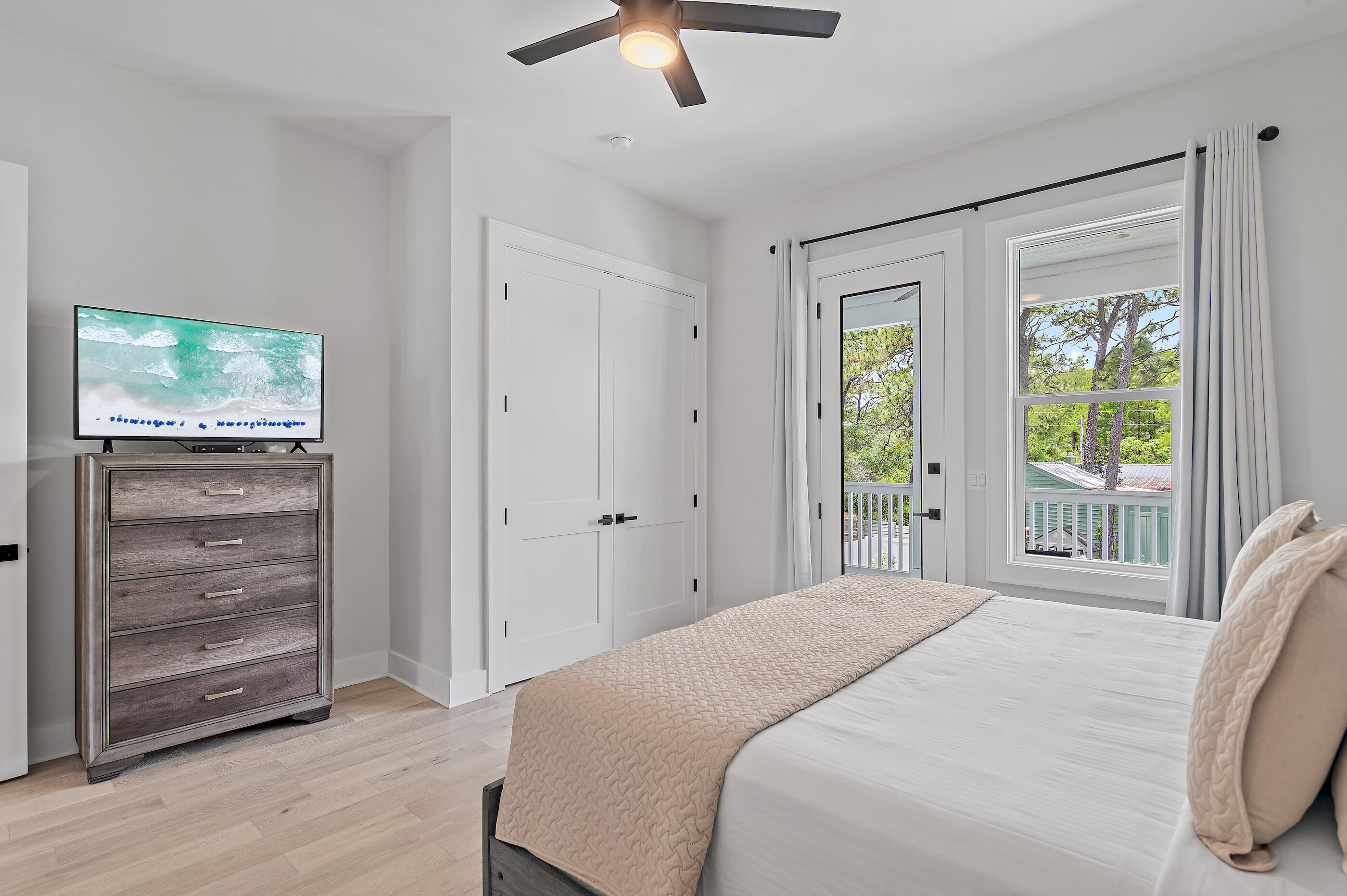 13 Jp Lane Santa Rosa Beach, FL 32459 - Photo 20 of 31 a bedroom with a bed and a large window