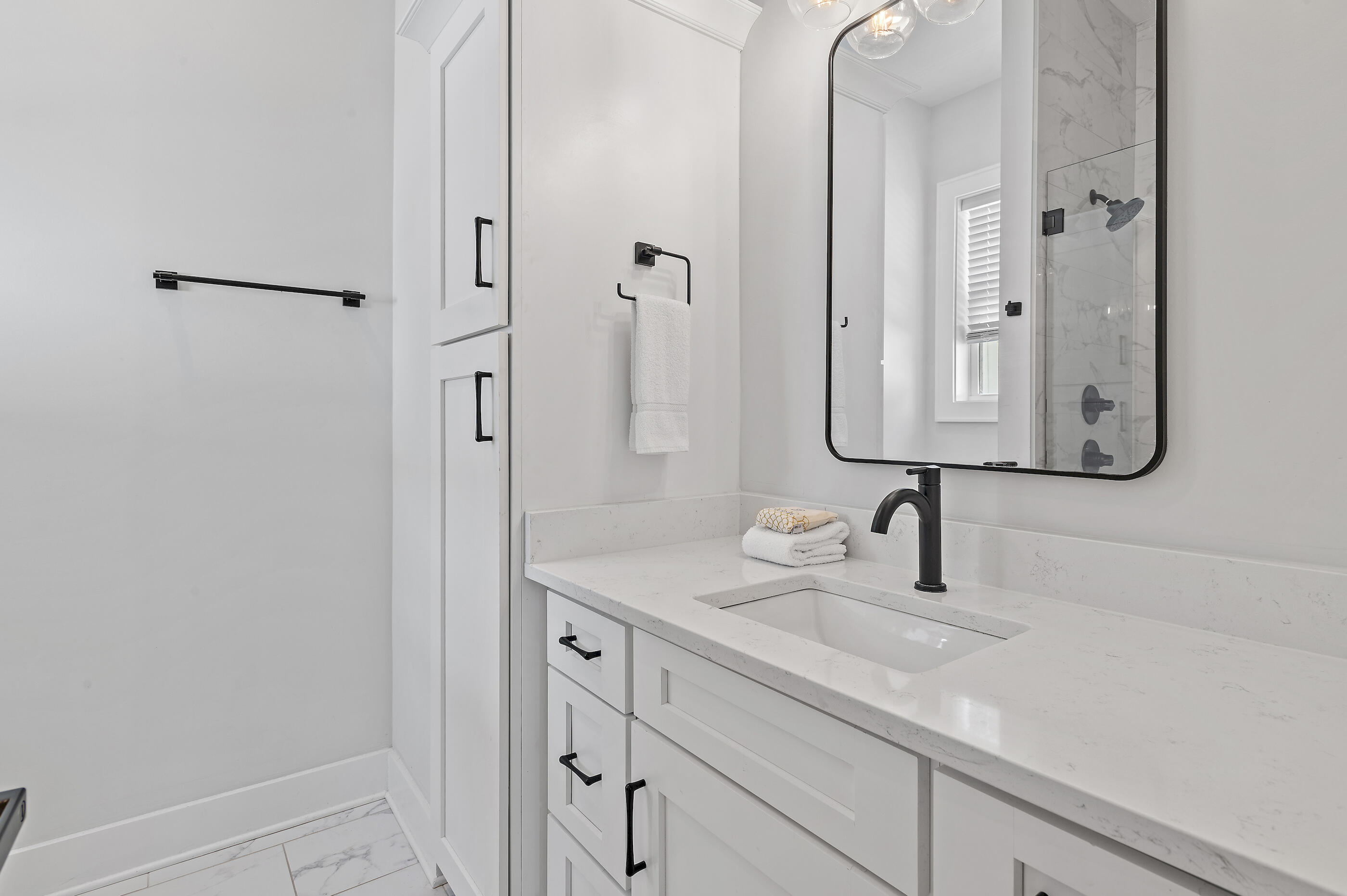 13 Jp Lane Santa Rosa Beach, FL 32459 - Photo 21 of 31 a bathroom with a sink and a mirror