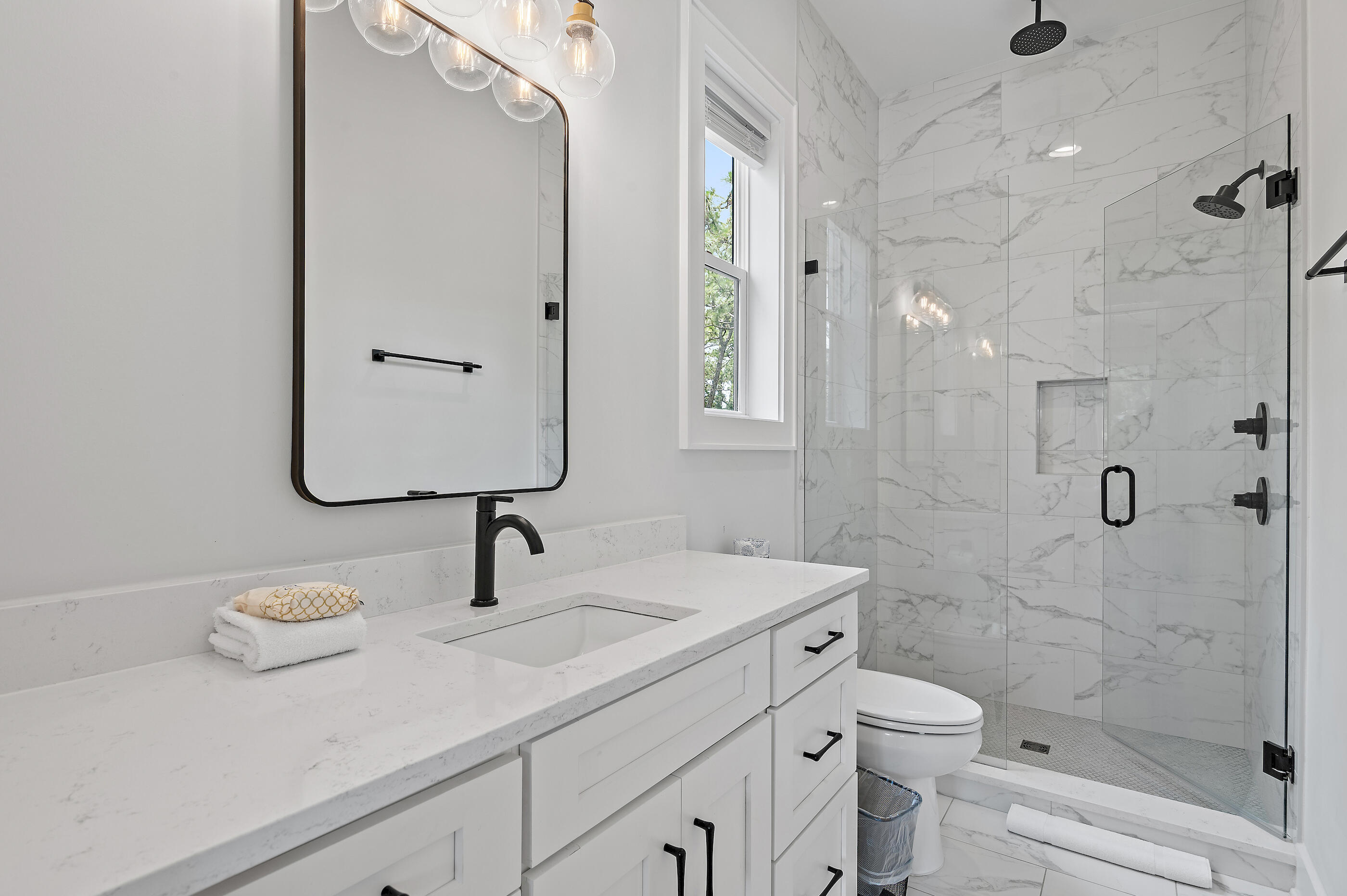 13 Jp Lane Santa Rosa Beach, FL 32459 - Photo 26 of 31 a bathroom with a sink a toilet and shower