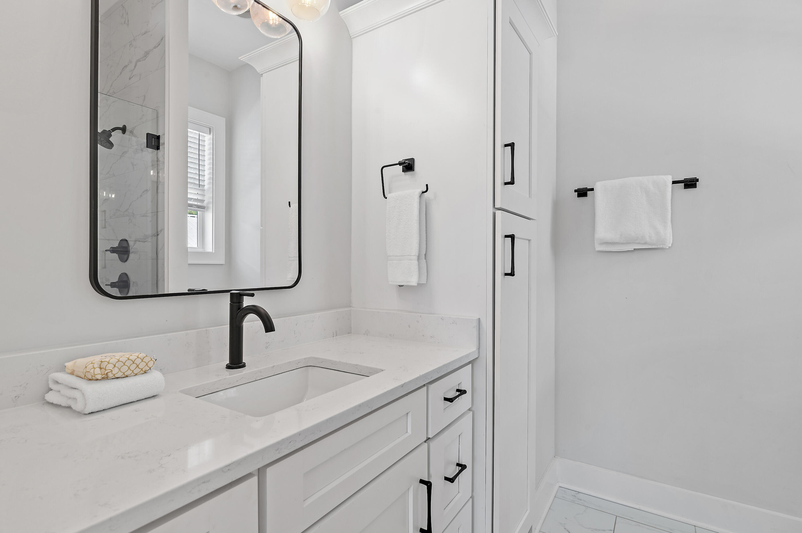 13 Jp Lane Santa Rosa Beach, FL 32459 - Photo 28 of 31 a bathroom with a sink and mirror