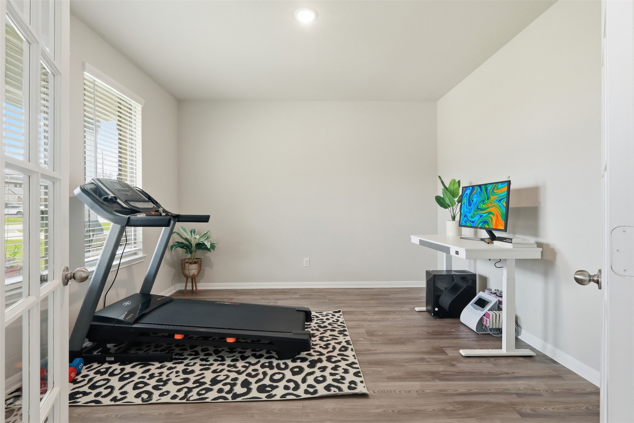 6310 Fawn Path Drive Conroe, TX 77303 - Photo 6 of 41 Work from home with ease in this private office featuring abundant natural light, beautiful flooring, and a versatile layout.