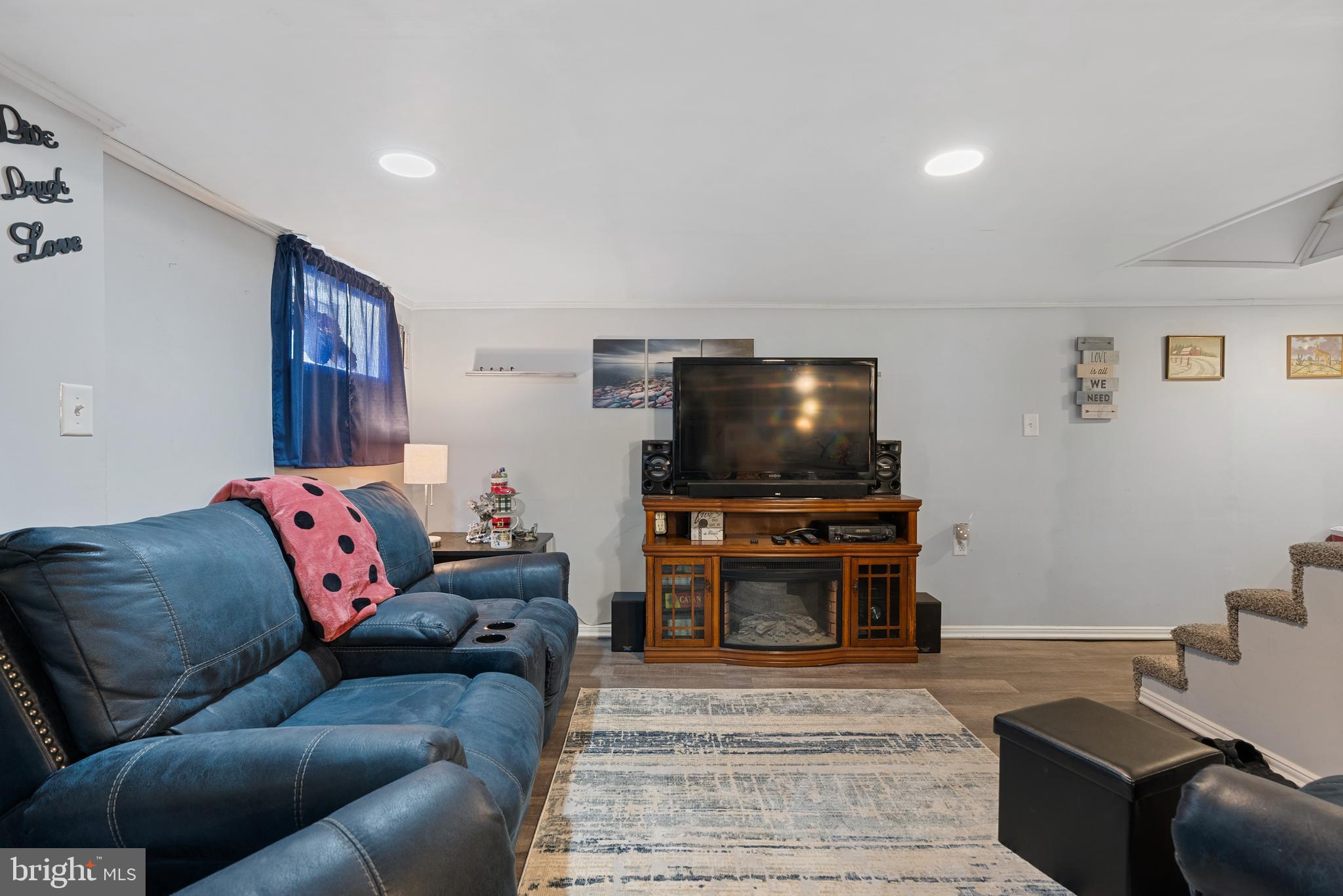 70 Del Rio Road Baltimore, MD 21222 - Photo 20 of 40 a living room with furniture and a flat screen tv
