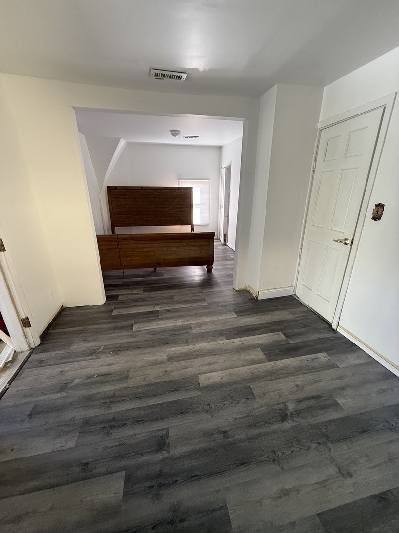 732 North Dearborn Avenue Kankakee, IL 60901 - Photo 12 of 21 a view of entryway wooden floor and front door