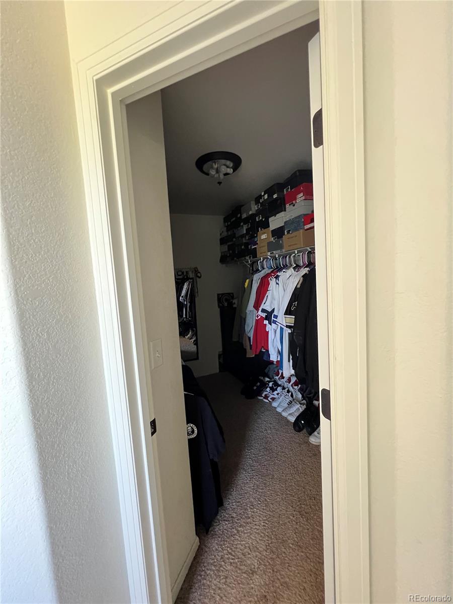 787 Rodgers Circle Platteville, CO 80651 - Photo 11 of 20 a view of a closet with storage