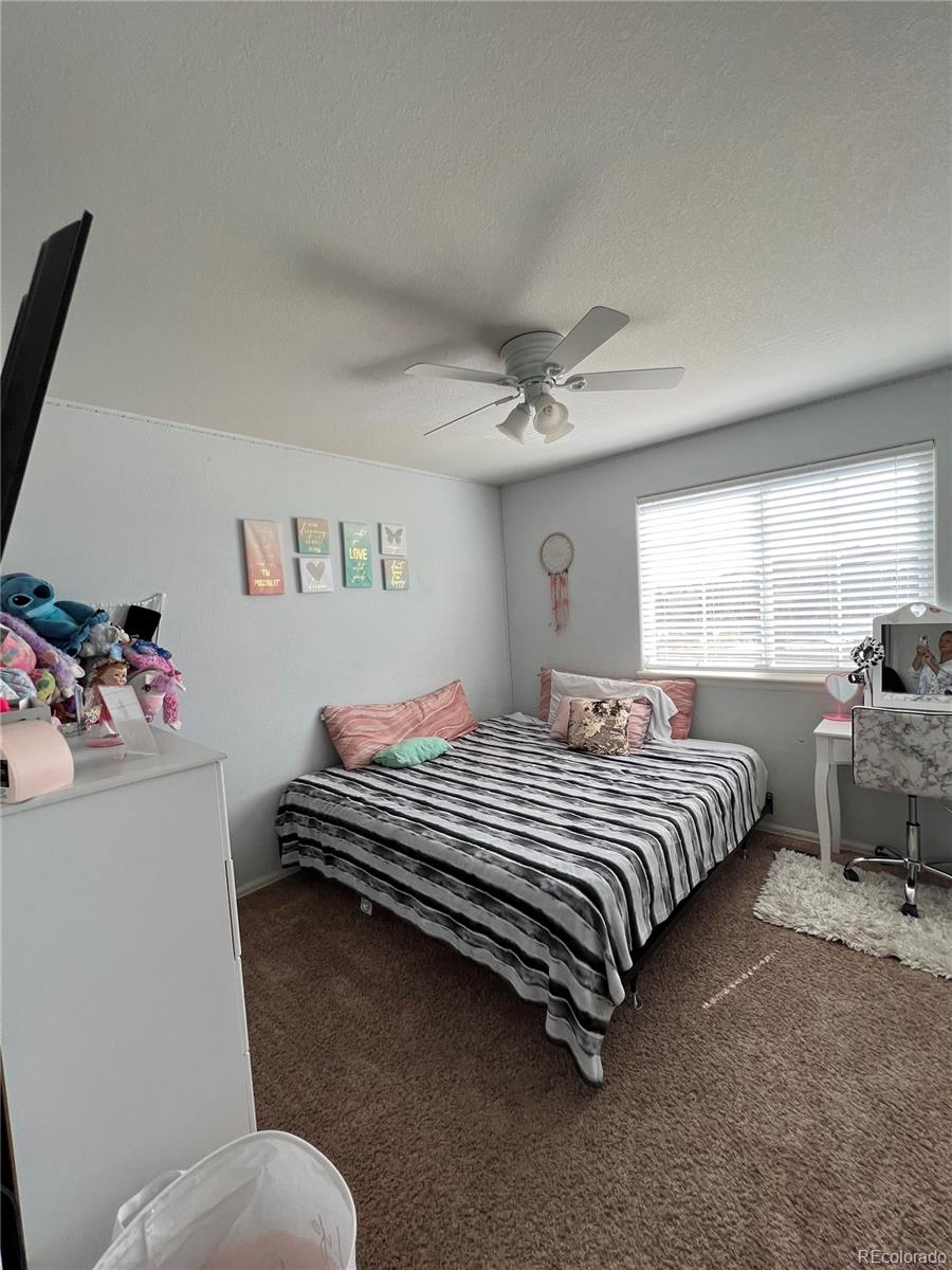 787 Rodgers Circle Platteville, CO 80651 - Photo 12 of 20 a bedroom with a bed and window