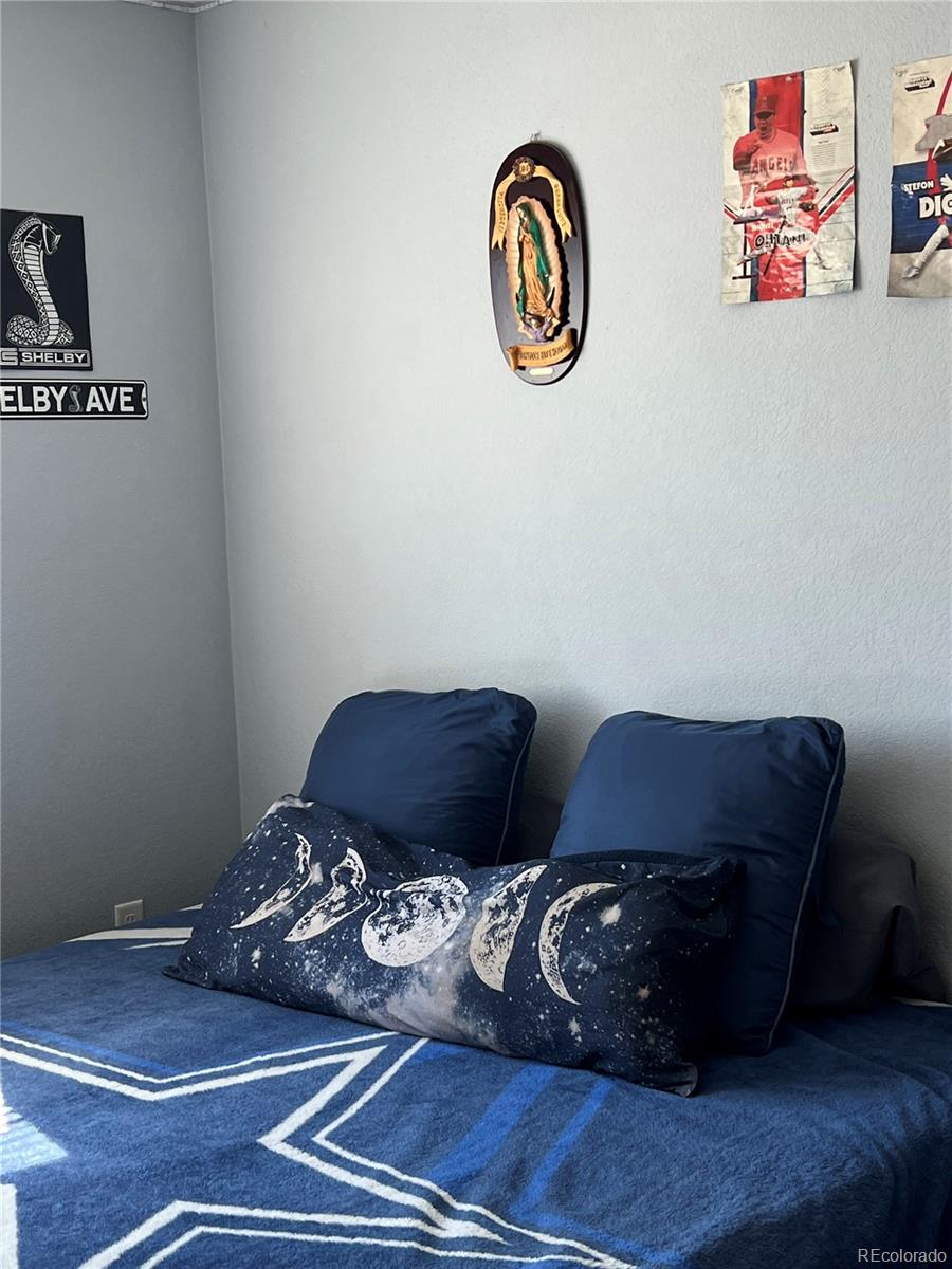 787 Rodgers Circle Platteville, CO 80651 - Photo 14 of 20 a view of a room with wooden floor