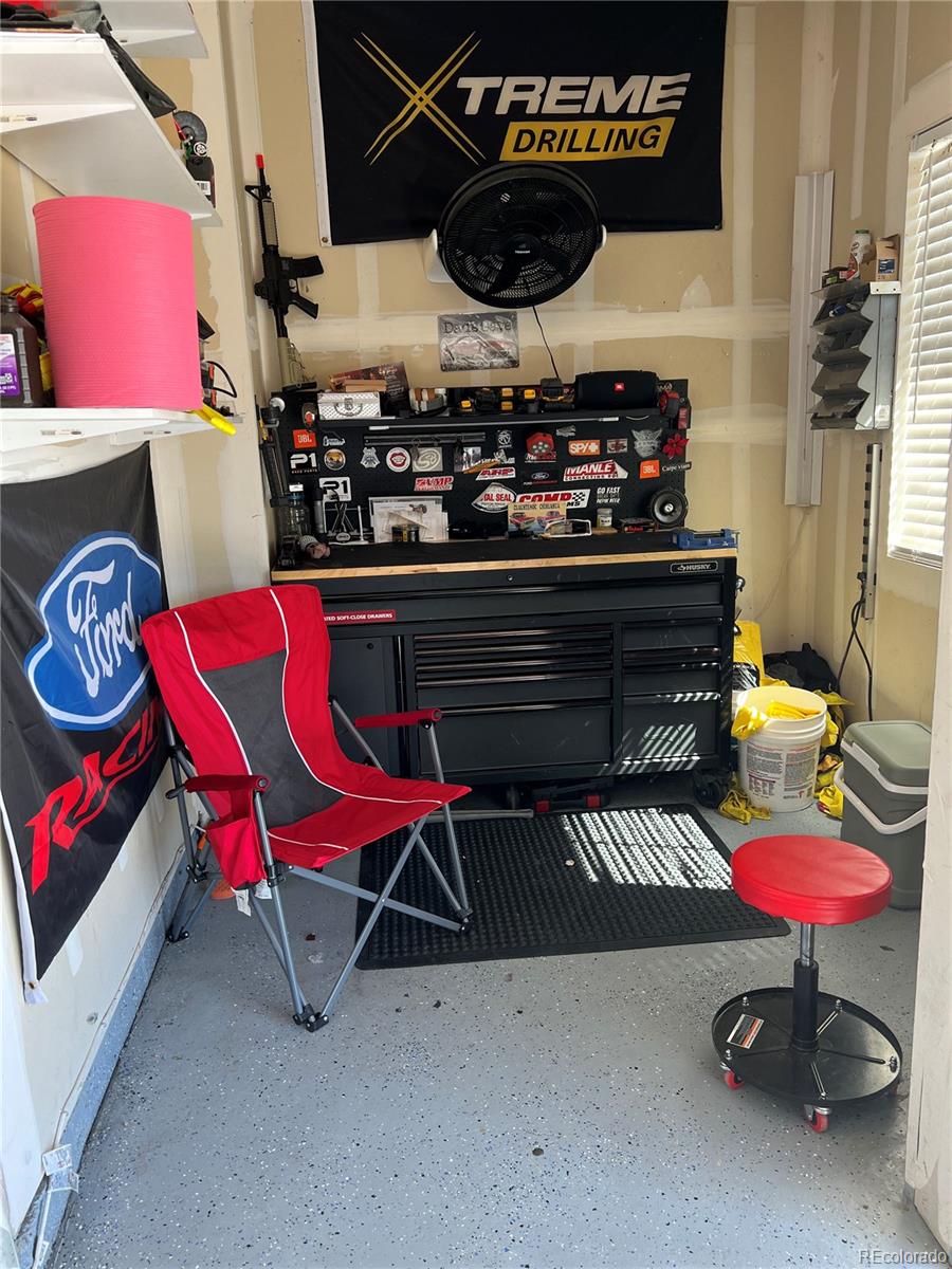 787 Rodgers Circle Platteville, CO 80651 - Photo 17 of 20 a room with musical instruments and a racks