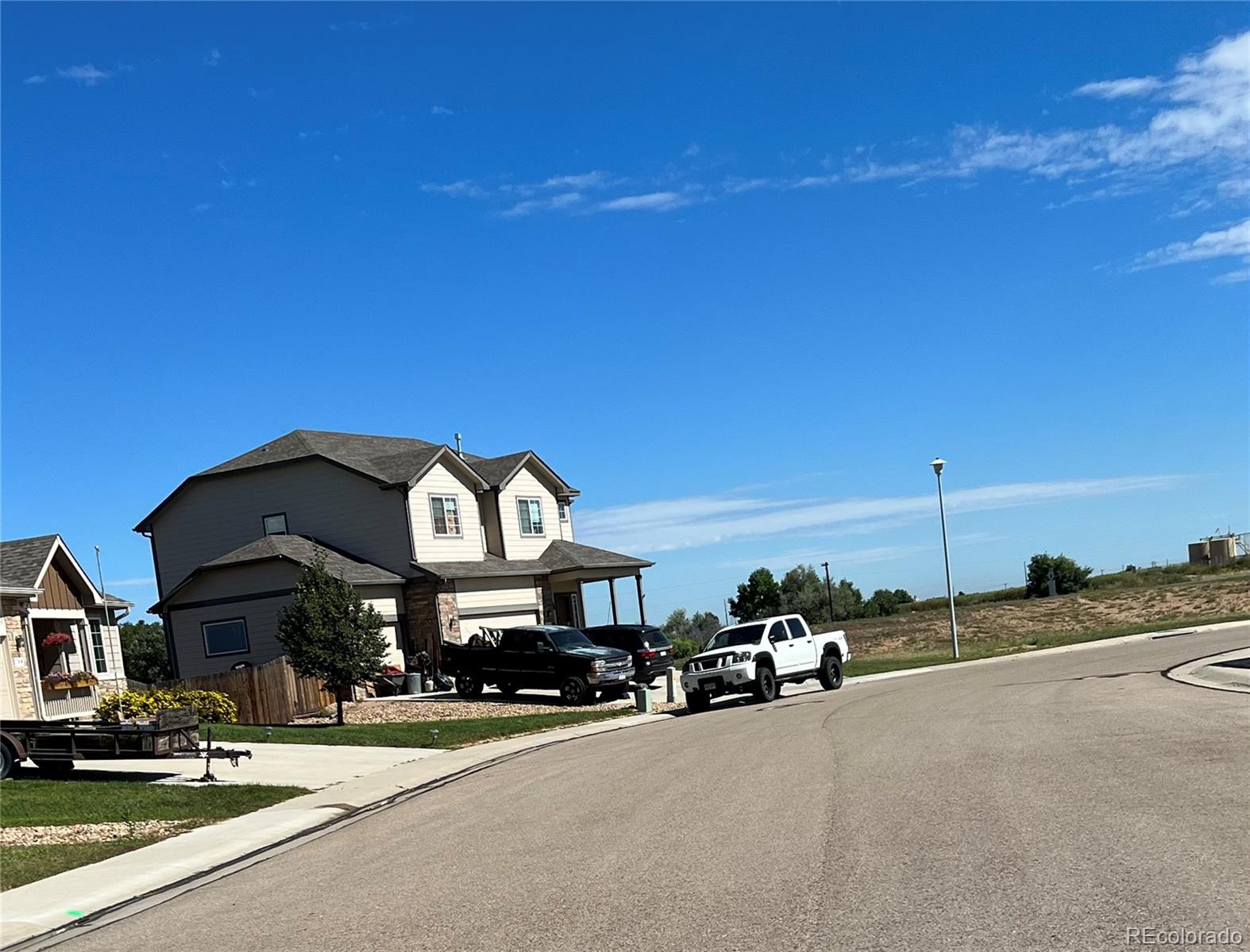 787 Rodgers Circle Platteville, CO 80651 - Photo 2 of 20 a view of a street with cars