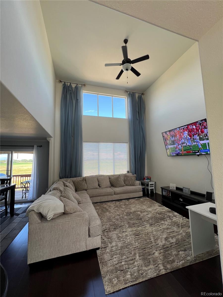 787 Rodgers Circle Platteville, CO 80651 - Photo 7 of 20 a living room with furniture and a large window