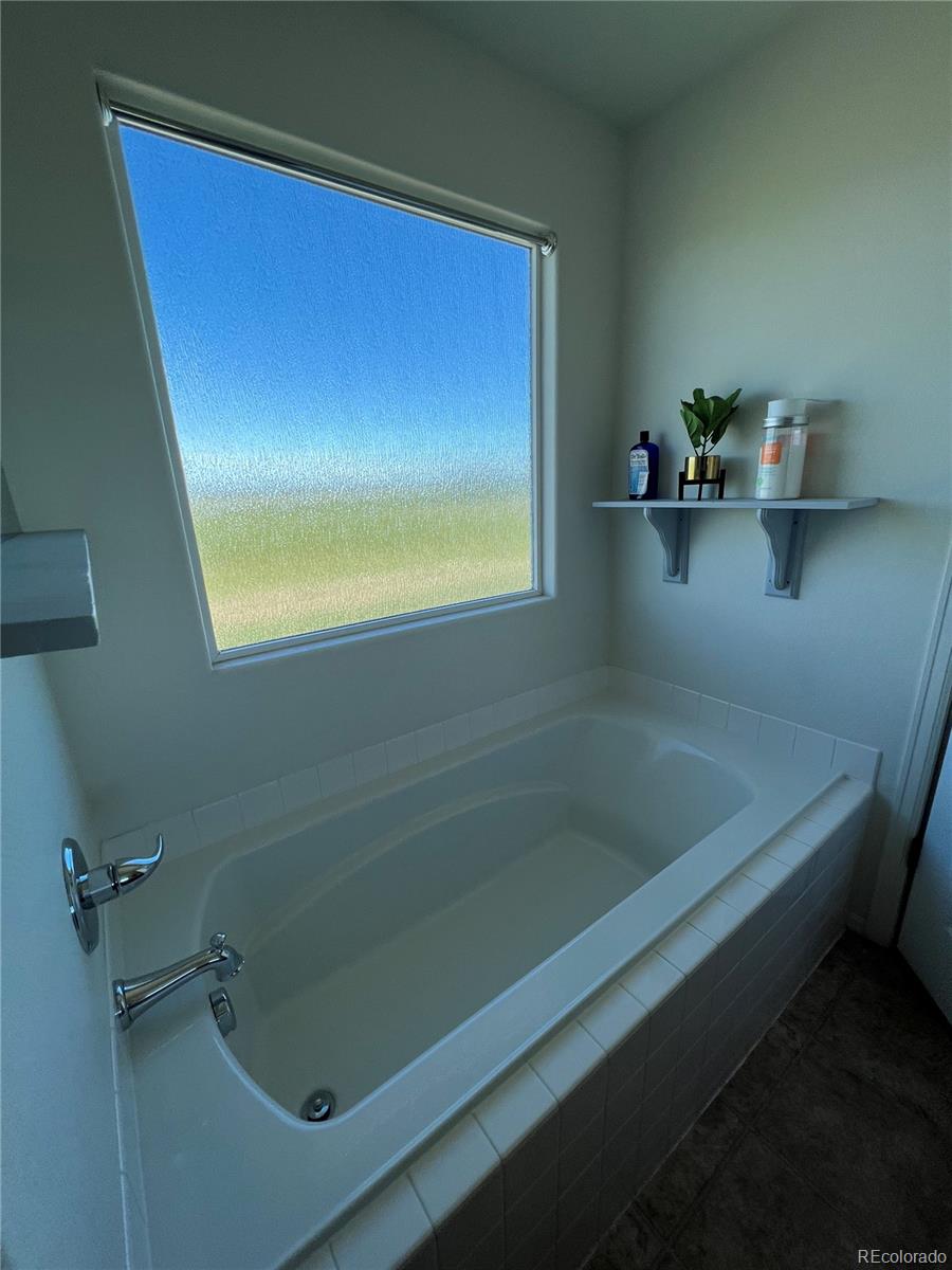 787 Rodgers Circle Platteville, CO 80651 - Photo 10 of 20 a bathroom with a bathtub