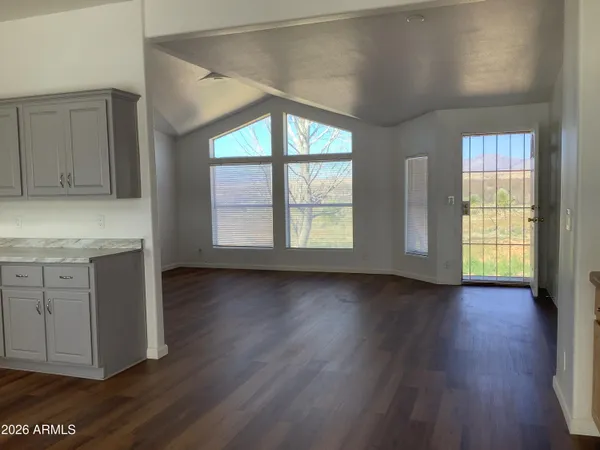 a kitchen with granite countertop a stove and a sink