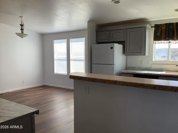 a bedroom with a bed and wooden cabinets