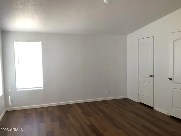 a view of a small space with wooden floor