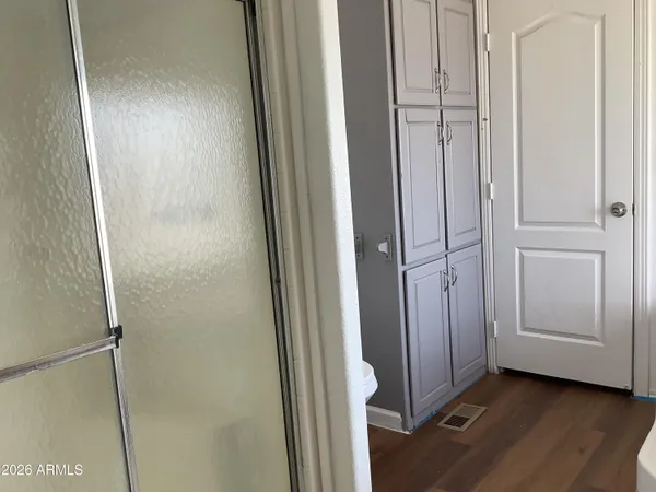 a spacious bathroom with a bathtub sink and mirror
