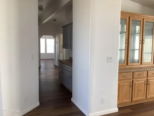 a view of a kitchen cabinets and a wooden floor