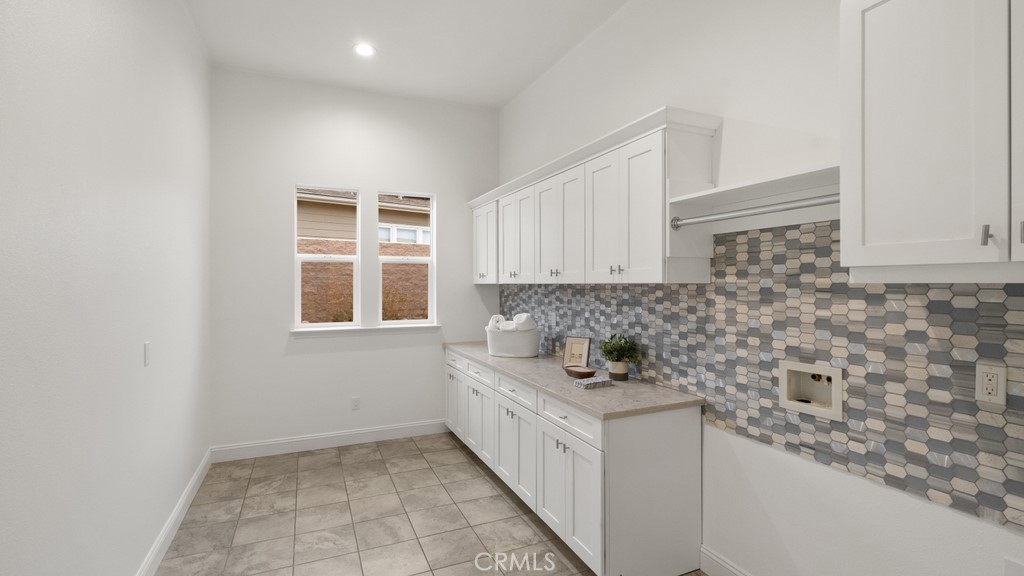 851 Trail View Place Nipomo, CA 93444 - Photo 19 of 47 a kitchen with a sink and cabinets