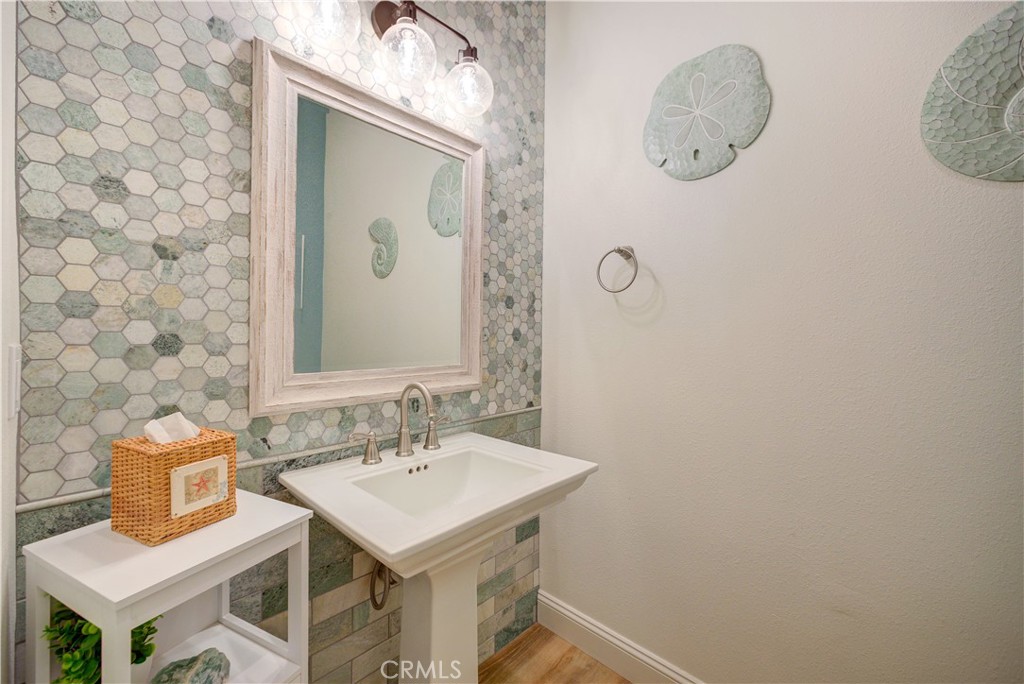 851 Trail View Place Nipomo, CA 93444 - Photo 24 of 47 a bathroom with a sink a mirror and a toilet