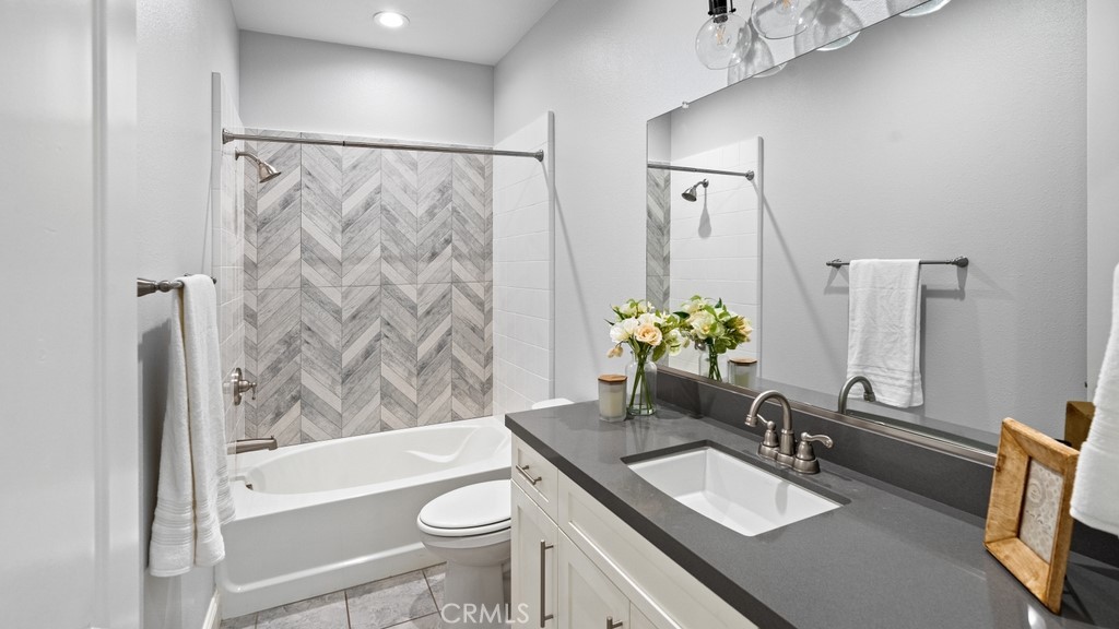 851 Trail View Place Nipomo, CA 93444 - Photo 26 of 47 a bathroom with a granite countertop sink toilet and shower