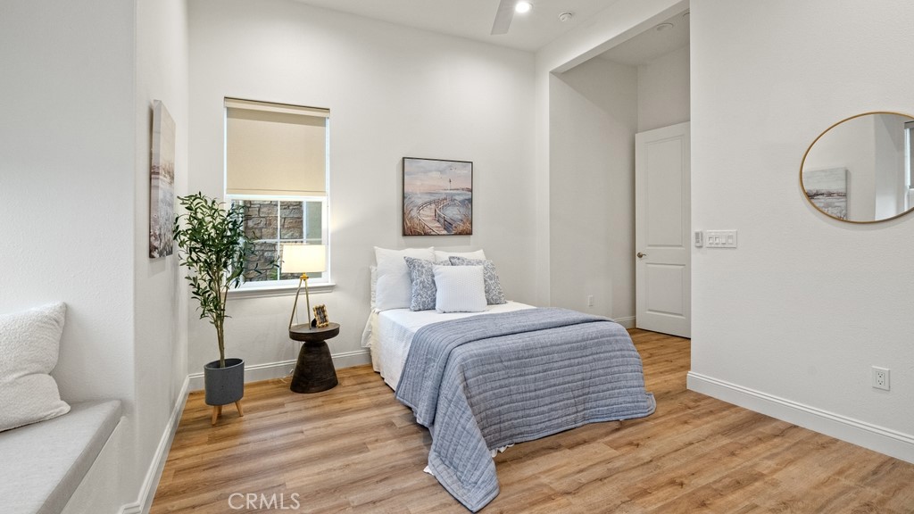 851 Trail View Place Nipomo, CA 93444 - Photo 28 of 47 a bedroom with a bed and a potted plant