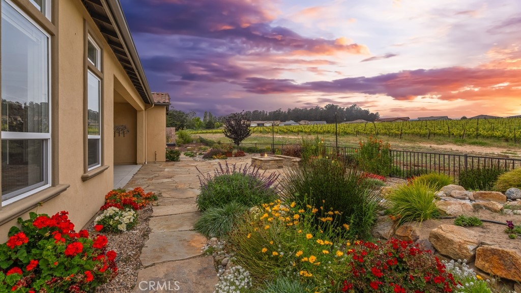 851 Trail View Place Nipomo, CA 93444 - Photo 33 of 47 a view of a lake with a flower garden