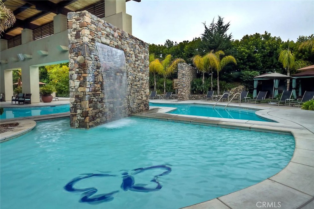 851 Trail View Place Nipomo, CA 93444 - Photo 45 of 47 a view of a swimming pool with a garden and plants