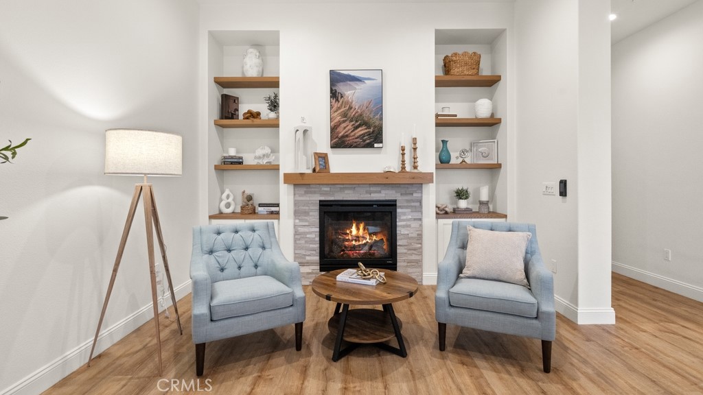 851 Trail View Place Nipomo, CA 93444 - Photo 6 of 47 a living room with furniture a lamp and a fireplace