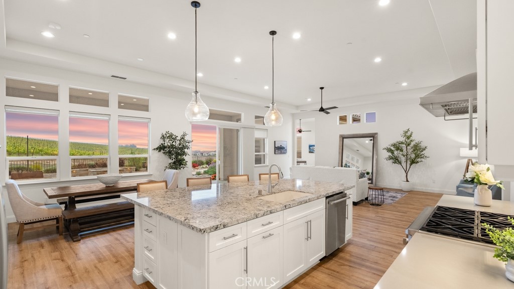 851 Trail View Place Nipomo, CA 93444 - Photo 8 of 47 a kitchen with stainless steel appliances granite countertop a stove a sink and a wooden floors