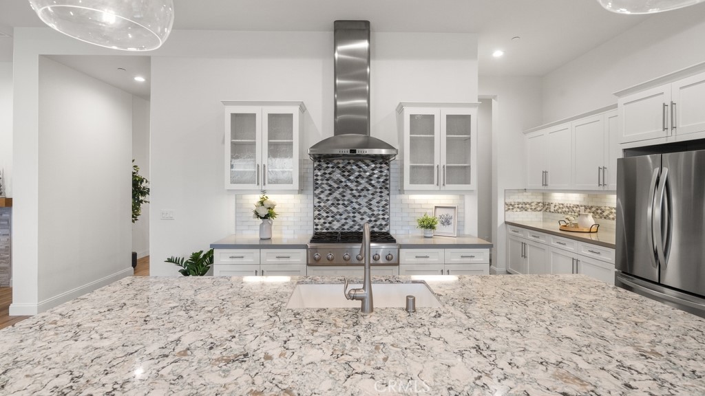 851 Trail View Place Nipomo, CA 93444 - Photo 10 of 47 a kitchen with refrigerator and oven