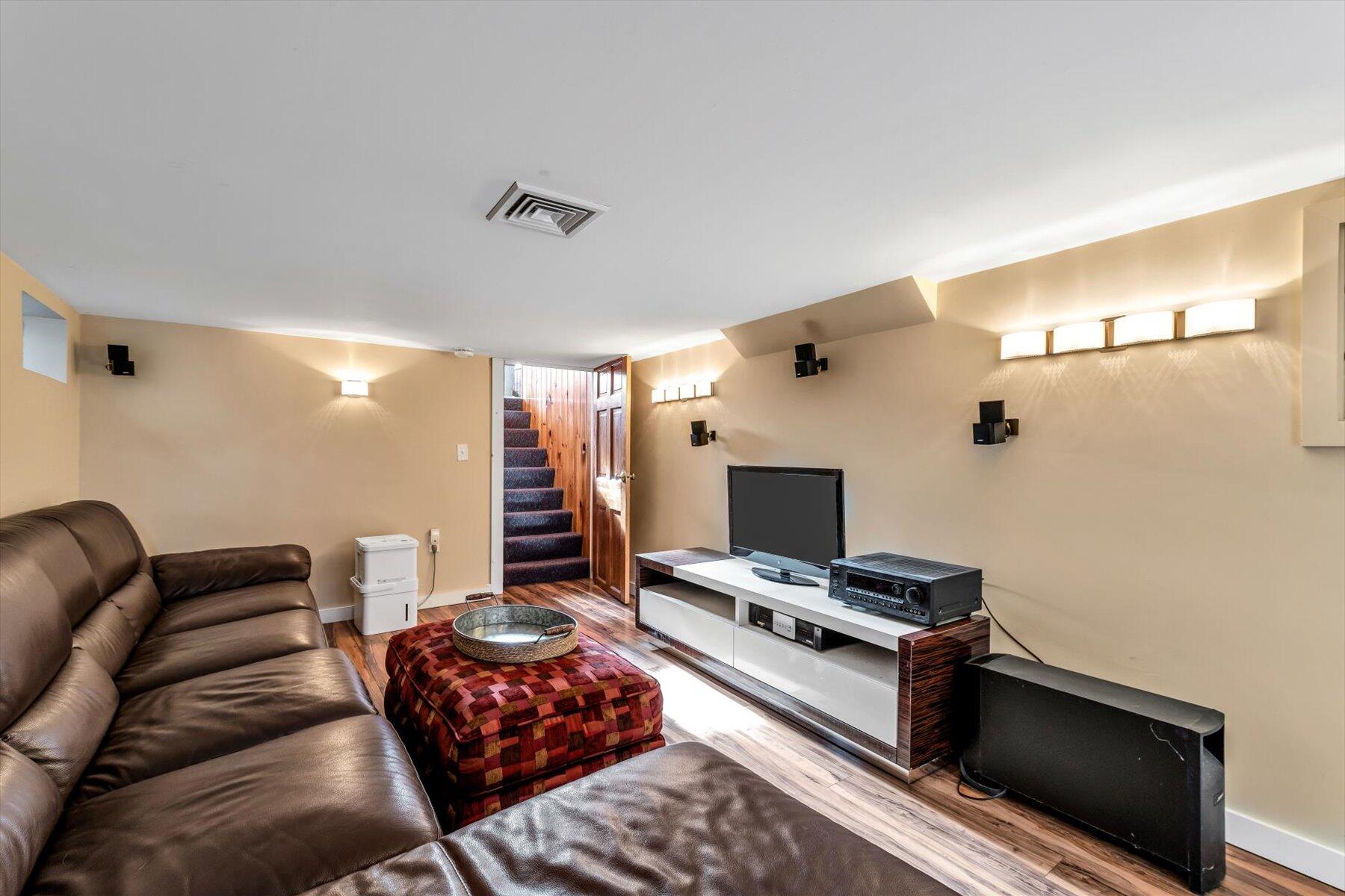 19 Pine Rock Road East Falmouth, MA 02536 - Photo 13 of 52 a bedroom with furniture and a flat screen tv