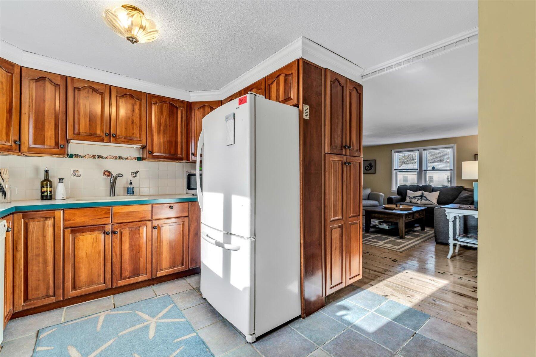 19 Pine Rock Road East Falmouth, MA 02536 - Photo 17 of 52 a kitchen with stainless steel appliances granite countertop a refrigerator and a sink