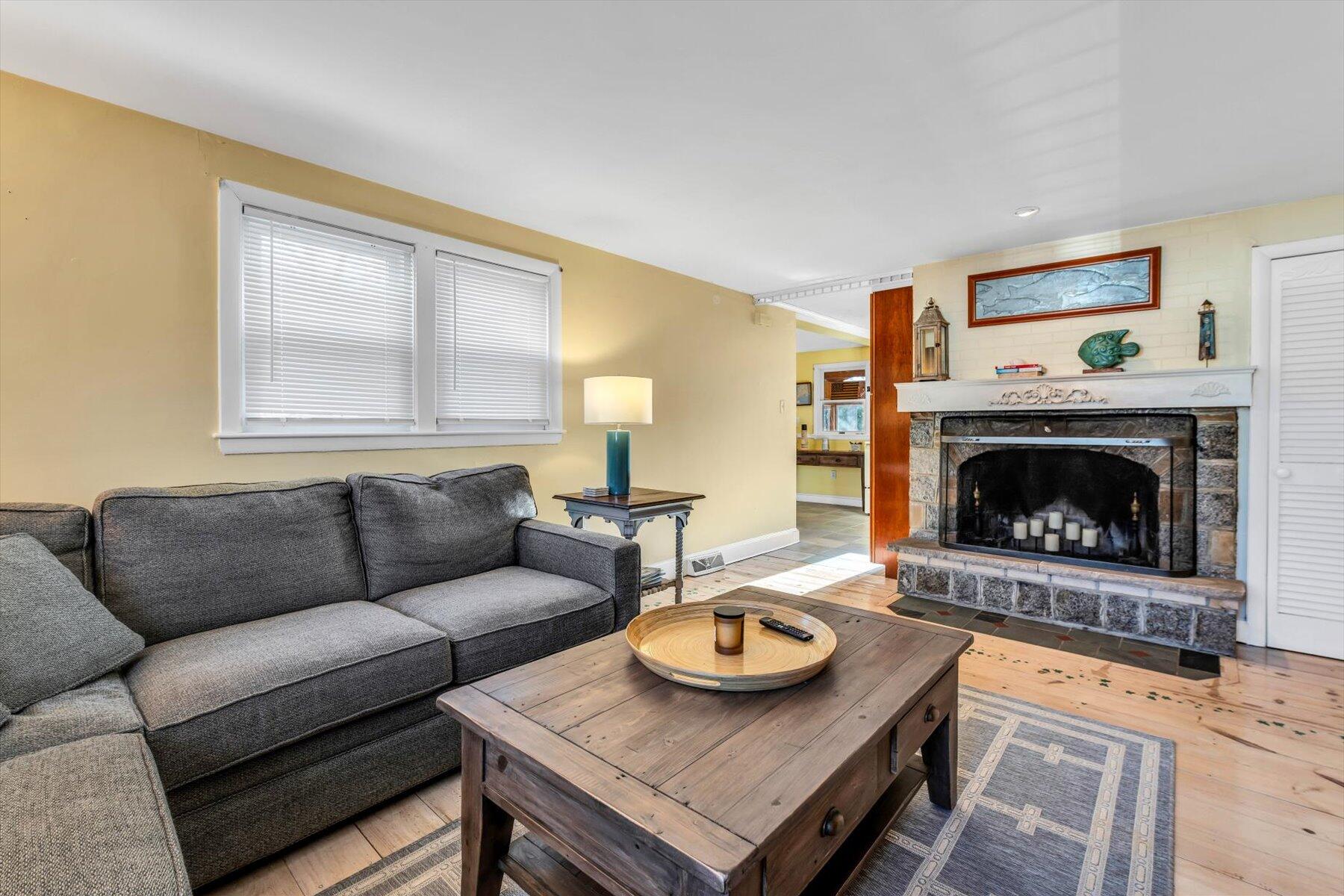 19 Pine Rock Road East Falmouth, MA 02536 - Photo 19 of 52 a living room with furniture and a fireplace