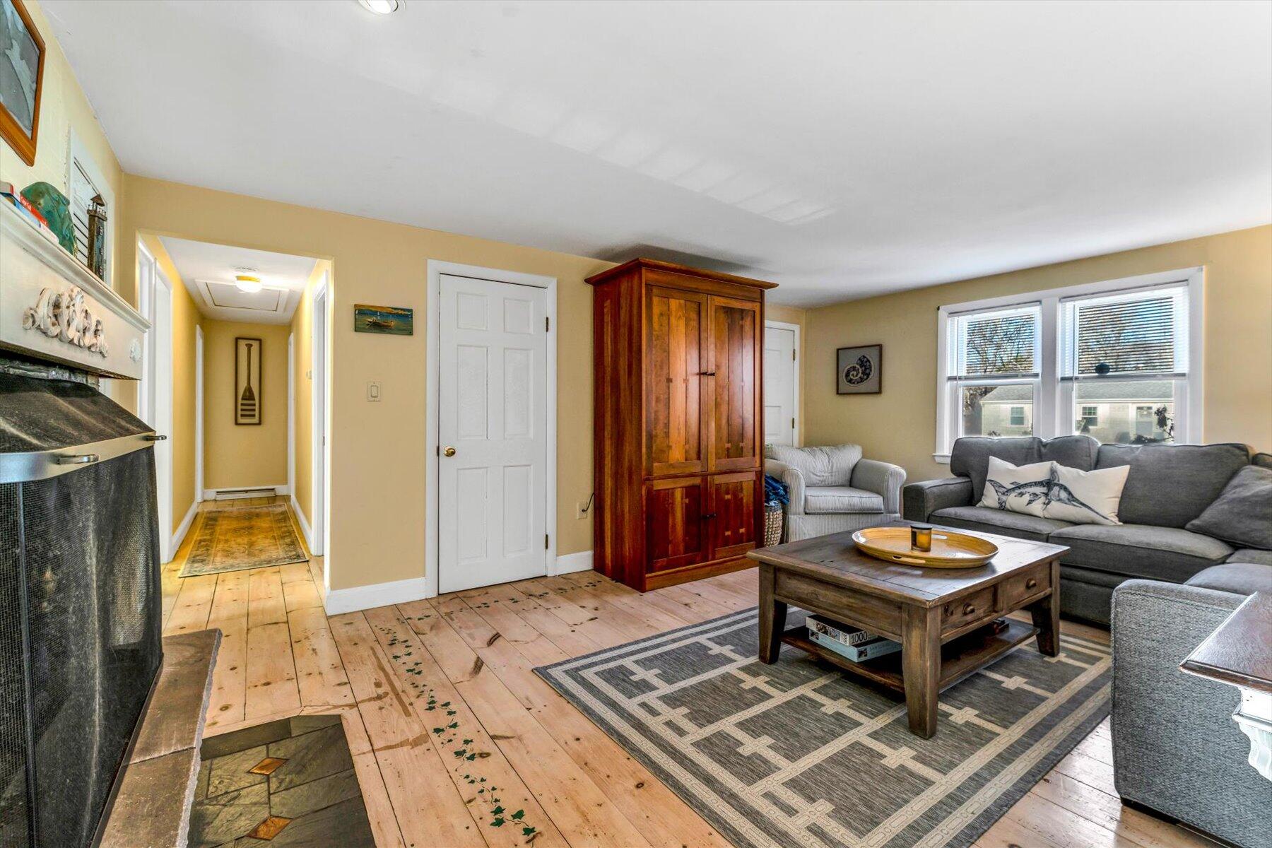19 Pine Rock Road East Falmouth, MA 02536 - Photo 22 of 52 a living room with furniture and a wooden floor