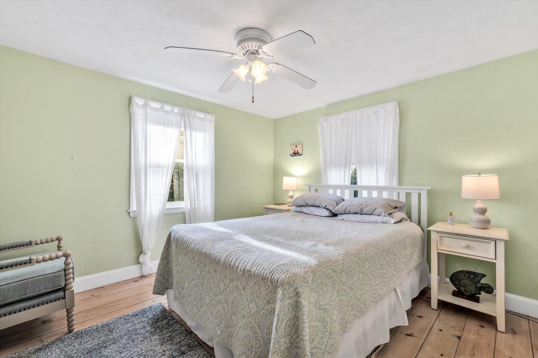 19 Pine Rock Road East Falmouth, MA 02536 - Photo 23 of 52 a bedroom with a bed and a chandelier