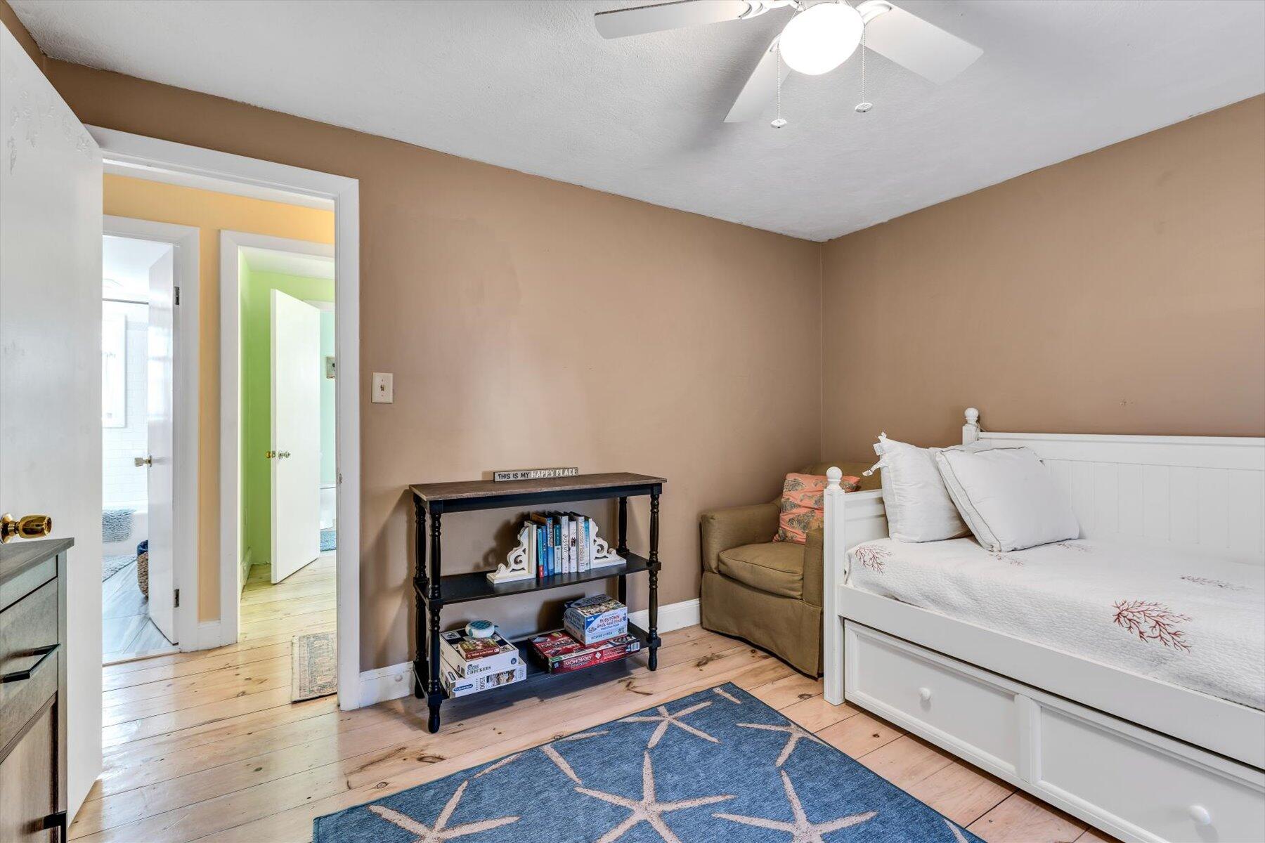 19 Pine Rock Road East Falmouth, MA 02536 - Photo 31 of 52 a living room with furniture and a wooden floor