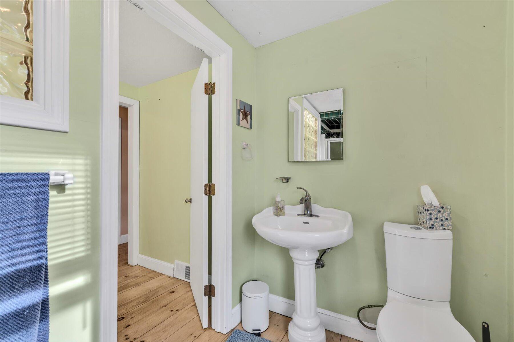 19 Pine Rock Road East Falmouth, MA 02536 - Photo 35 of 52 a bathroom with a sink mirror and toilet